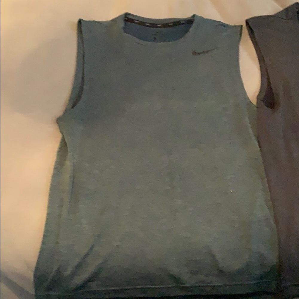 Two mens Nike sleeveless shirts